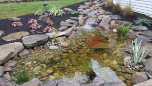 Pond That Shows Rocks Lining the Bottom Instead Of Plain Liner