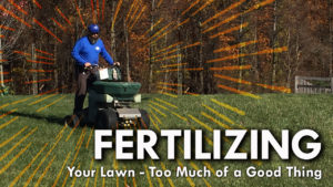Lawn Care Professional Applying Fertilizer To Lawn