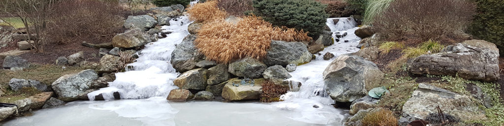 Pond With Two Frozen Waterfalls